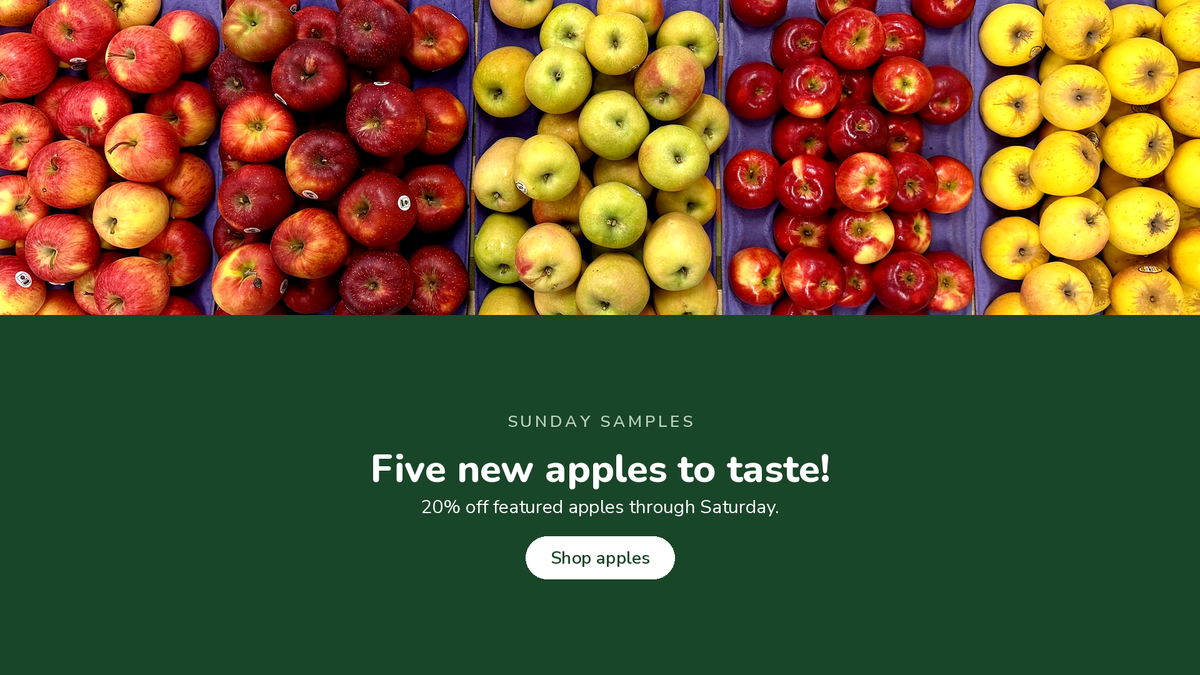Five apples on purple trays