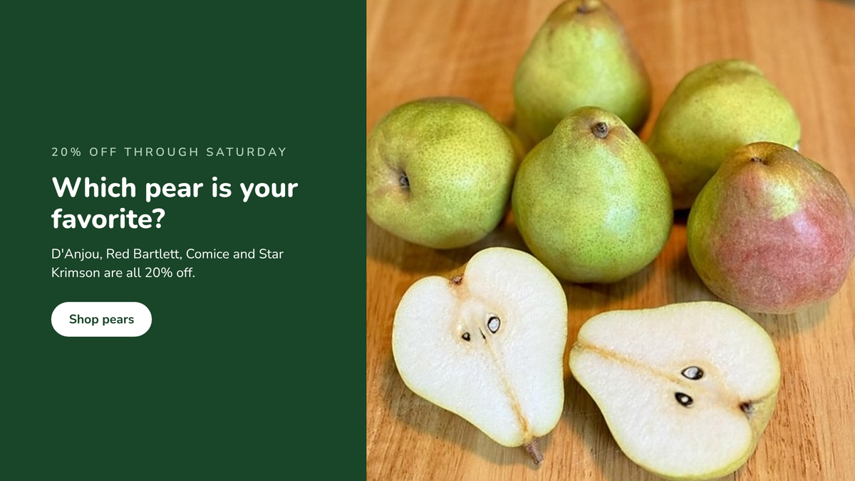 Comice, D'Anjou and Red Bartlett pears on a wooden board